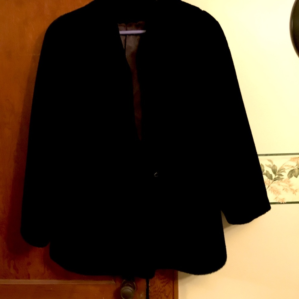 Faux fur coat Vintagege coat with satin lining. Clasp closure at neck